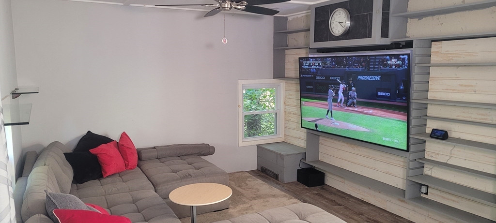 123 West River Road Hooksett, NH 03106 - Photo 14 of 40 a living room with furniture and a fireplace