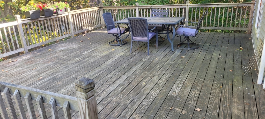 123 West River Road Hooksett, NH 03106 - Photo 19 of 40 a view of balcony with wooden floor and outdoor seating