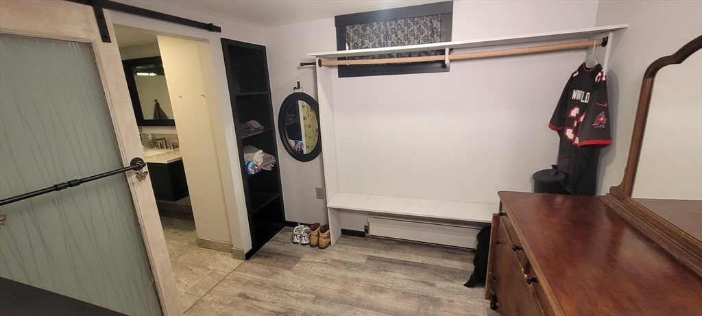 123 West River Road Hooksett, NH 03106 - Photo 22 of 40 a view of walk in closet with clothes and shoes