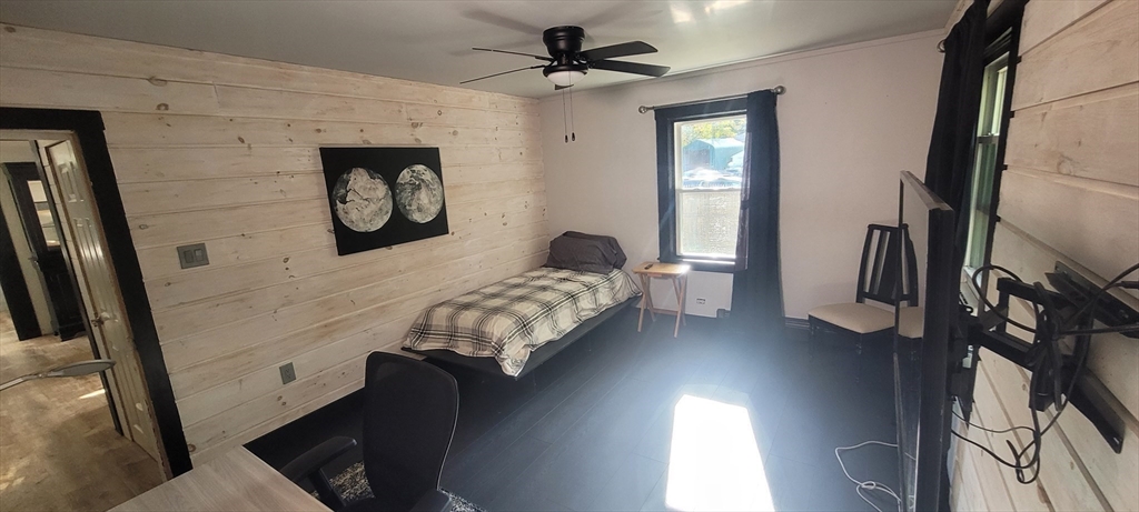 123 West River Road Hooksett, NH 03106 - Photo 27 of 40 a bedroom with a bed and a mirror