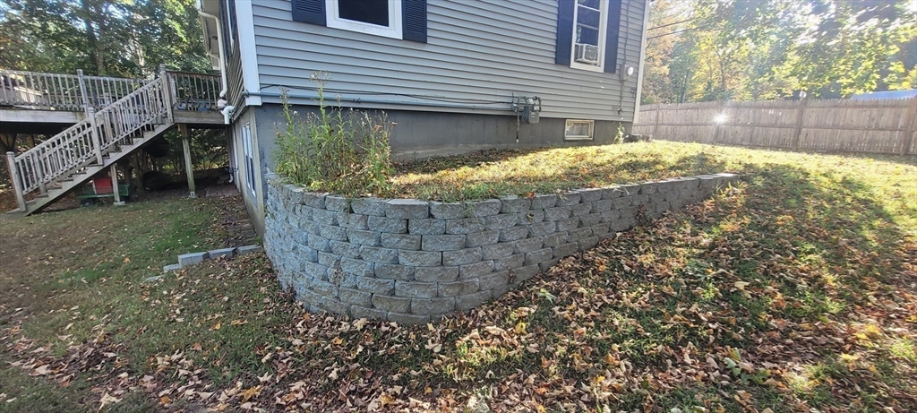 123 West River Road Hooksett, NH 03106 - Photo 33 of 40 a view of a house with a small yard and large tree