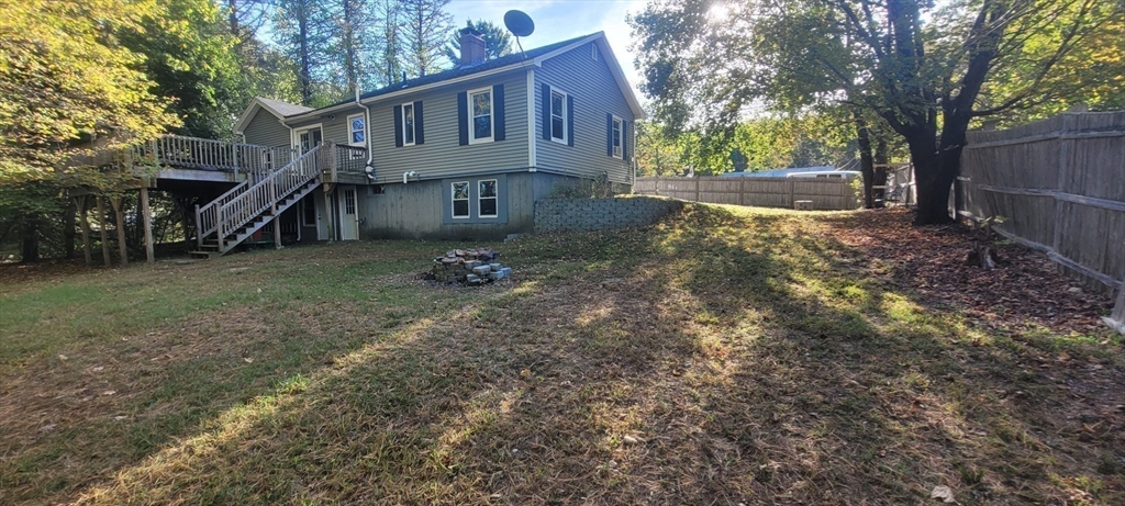 123 West River Road Hooksett, NH 03106 - Photo 34 of 40 a front view of a house with a yard