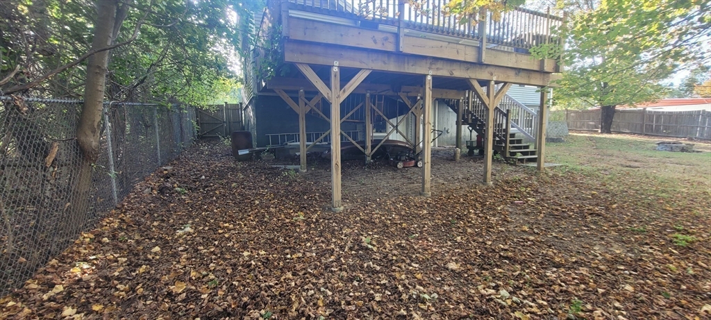 123 West River Road Hooksett, NH 03106 - Photo 36 of 40 a view of a wooden house with a yard