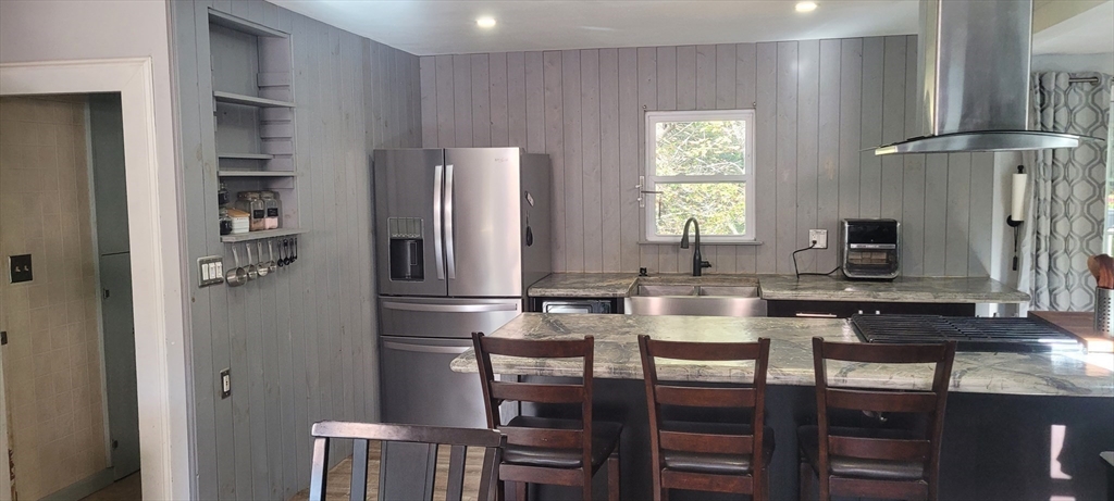 123 West River Road Hooksett, NH 03106 - Photo 6 of 40 a kitchen with refrigerator and cabinets