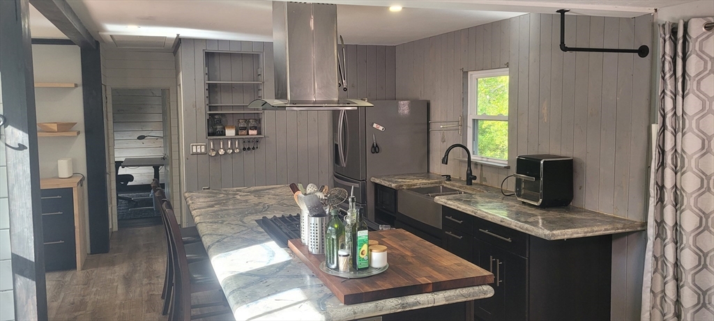 123 West River Road Hooksett, NH 03106 - Photo 8 of 40 a living room with dining table and chairs