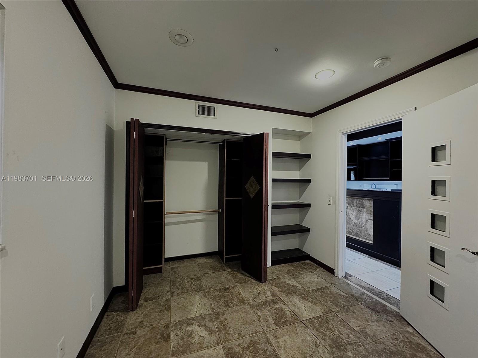3911 Farragut Street Hollywood, FL 33021 - Photo 11 of 26 a view of an empty room with a closet