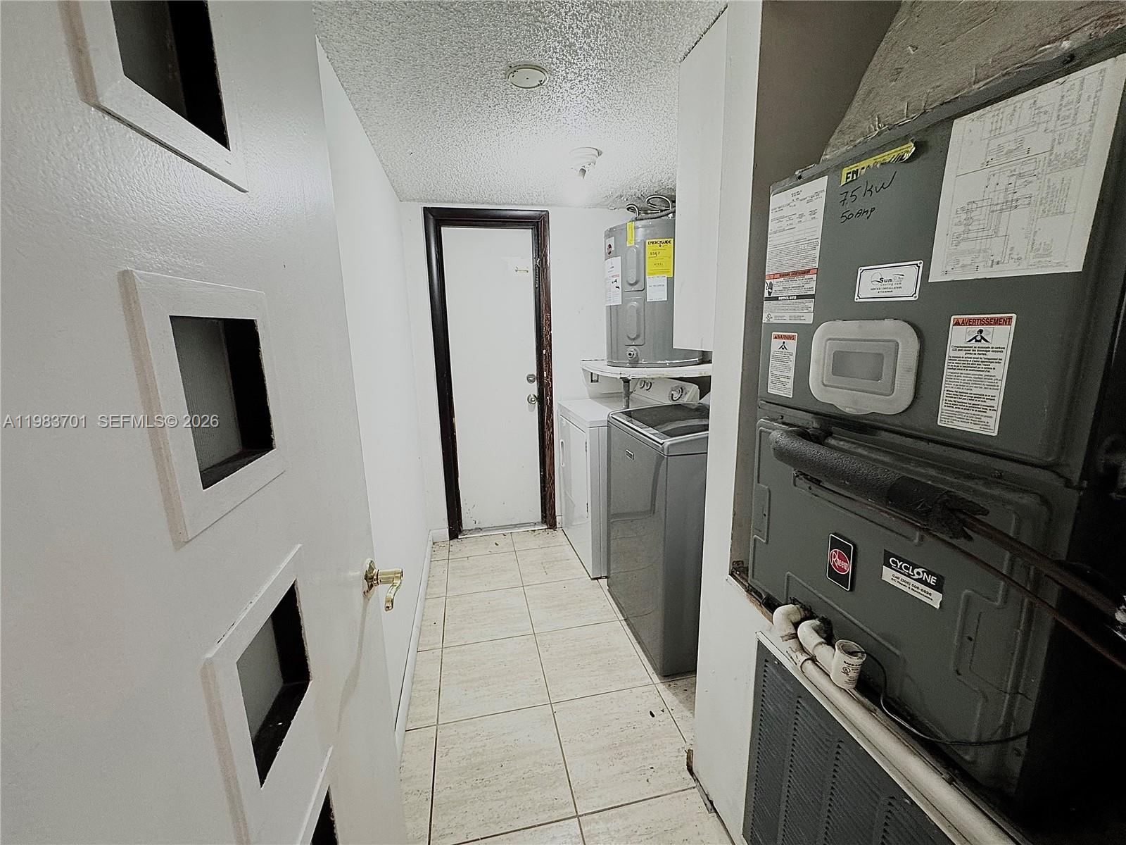 3911 Farragut Street Hollywood, FL 33021 - Photo 13 of 26 a kitchen with stainless steel appliances granite countertop a refrigerator and a stove