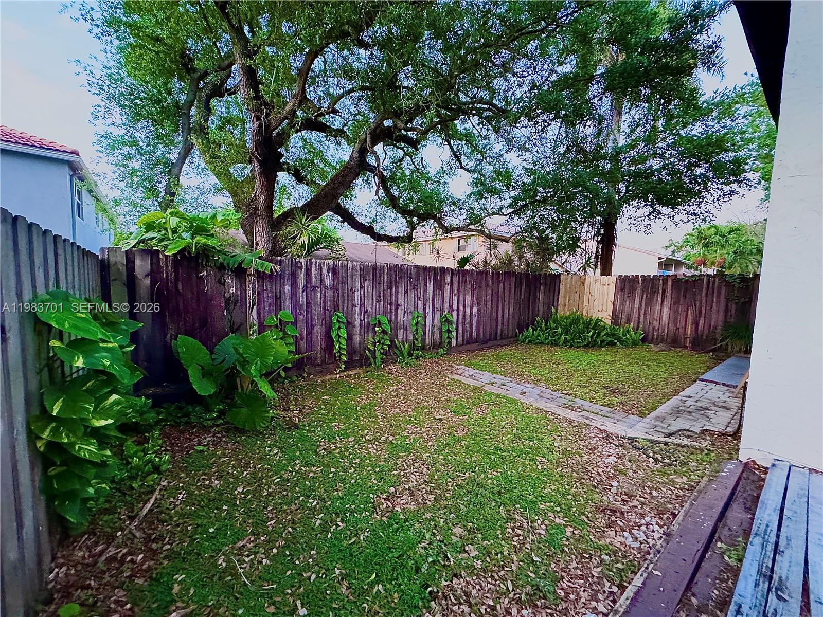 3911 Farragut Street Hollywood, FL 33021 - Photo 25 of 26 a view of a backyard with a garden