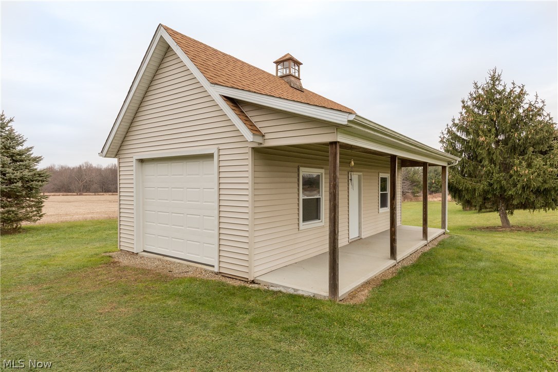 17511 Rapids Road Burton, OH 44021 - Photo 32 of 35 32x17 outbuilding. Lean to porch and windows with easy entrance/exit for equipment. GREAT storage.