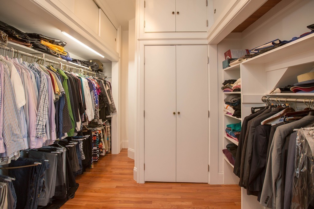 152 Winthrop Road, Unit 2 Brookline, MA 02445 - Photo 13 of 28 a view of walk in closet with clothes and shoes