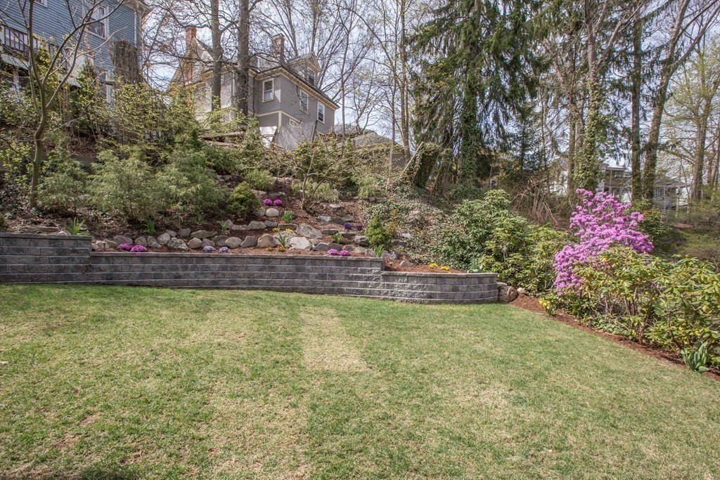 152 Winthrop Road, Unit 2 Brookline, MA 02445 - Photo 2 of 28 a view of a swimming pool with an outdoor space and seating area