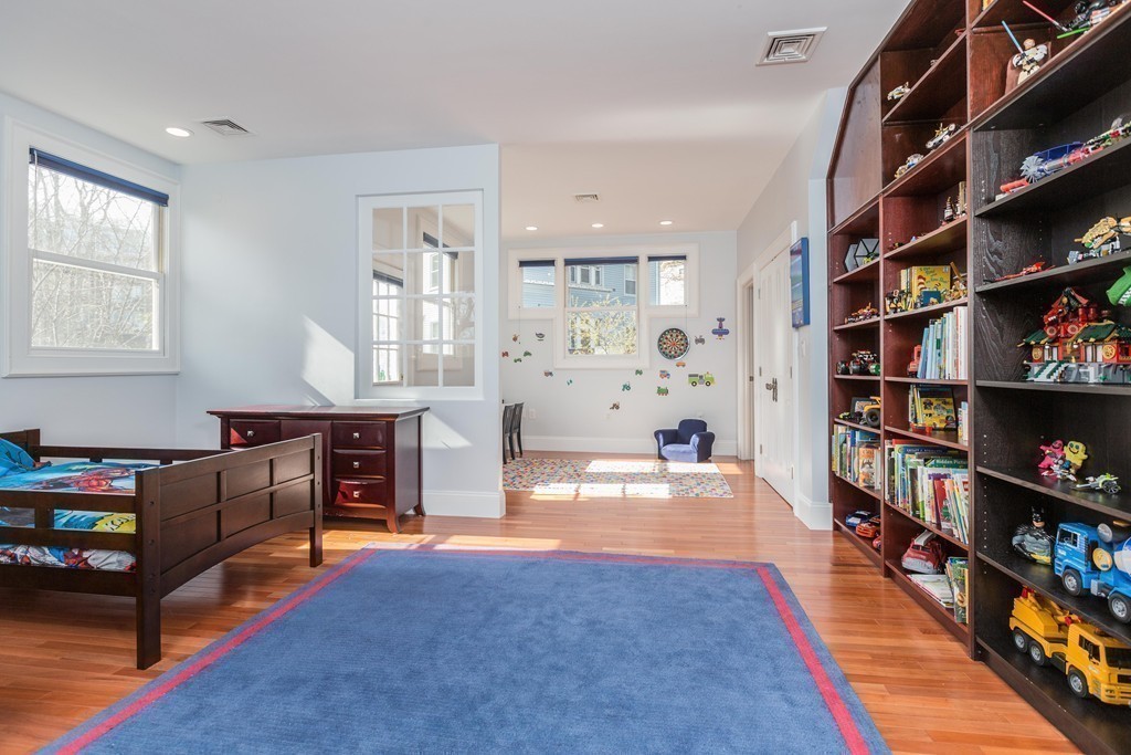 152 Winthrop Road, Unit 2 Brookline, MA 02445 - Photo 21 of 28 a living room with furniture and a book shelf