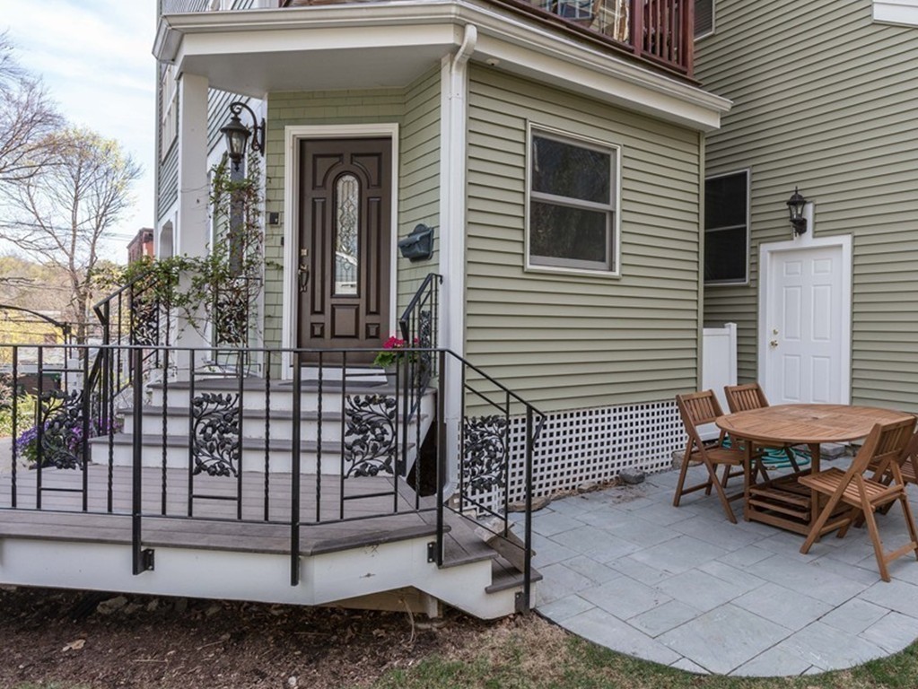 152 Winthrop Road, Unit 2 Brookline, MA 02445 - Photo 25 of 28 a view of a house with a yard and sitting area