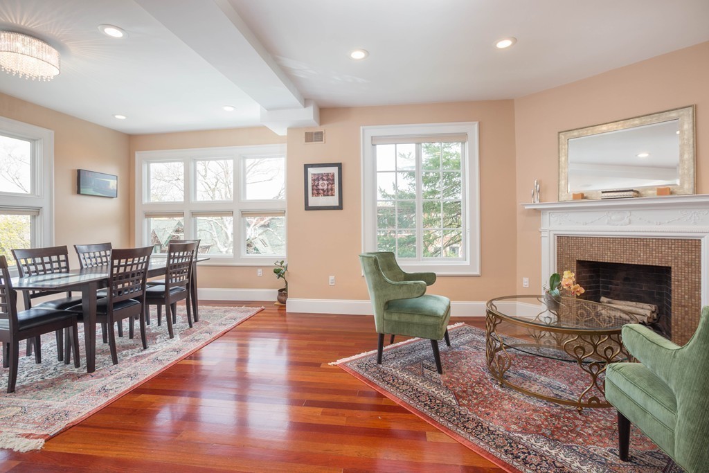 152 Winthrop Road, Unit 2 Brookline, MA 02445 - Photo 4 of 28 a living room with furniture a window and a fireplace