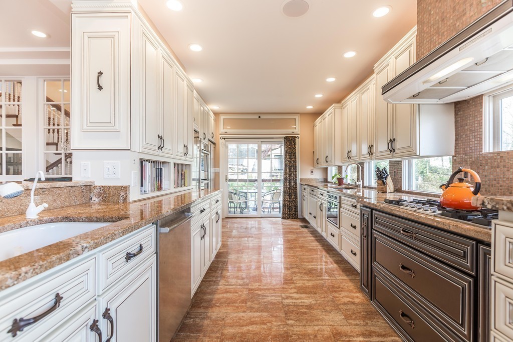 152 Winthrop Road, Unit 2 Brookline, MA 02445 - Photo 7 of 28 a large kitchen with stainless steel appliances granite countertop a lot of counter space and a sink