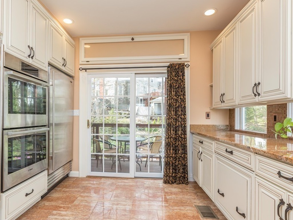 152 Winthrop Road, Unit 2 Brookline, MA 02445 - Photo 8 of 28 a kitchen with granite countertop a stove a sink and a granite counter tops