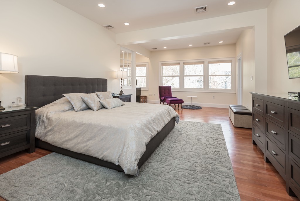 152 Winthrop Road, Unit 2 Brookline, MA 02445 - Photo 10 of 28 a spacious bedroom with a bed a couch and dresser