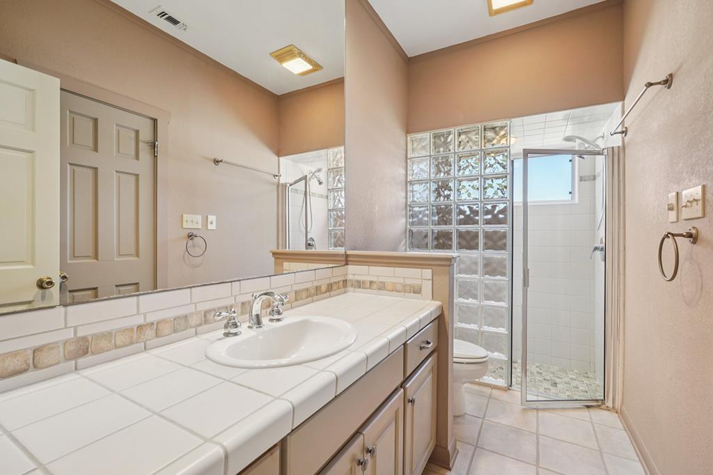 174 Cedar Rock Trail Southwest Hunt, TX 78024 - Photo 21 of 39 a bathroom with a sink double vanity and a mirror