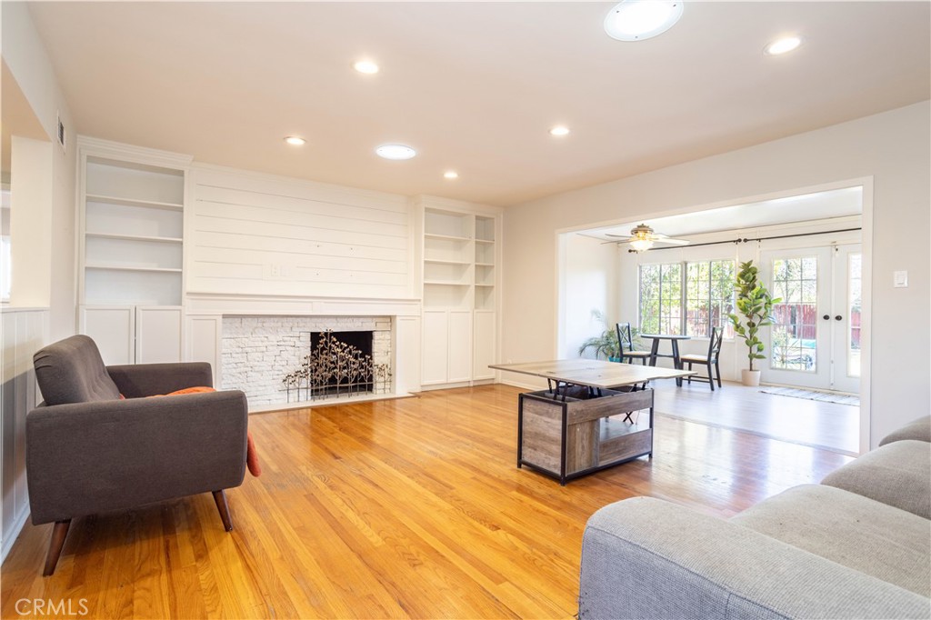 8534 Bothwell Road Northridge, CA 91324 - Photo 2 of 17 The Living Room features Hardwood floors, recessed lighting, and a brick fireplace!