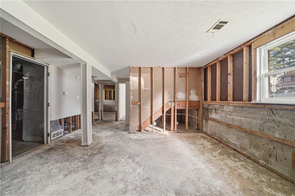 6865 Kimberly Mill Road Atlanta, GA 30349 - Photo 16 of 25 a view of an empty room with a window