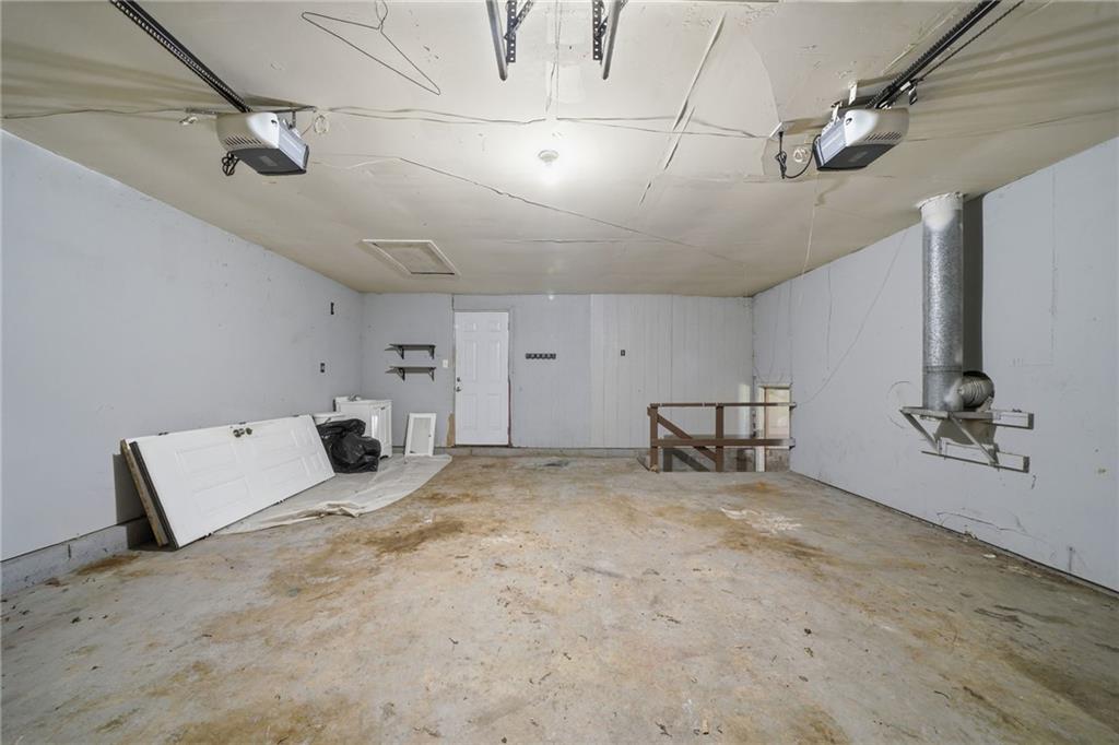 6865 Kimberly Mill Road Atlanta, GA 30349 - Photo 20 of 25 a view of a livingroom with a staircase