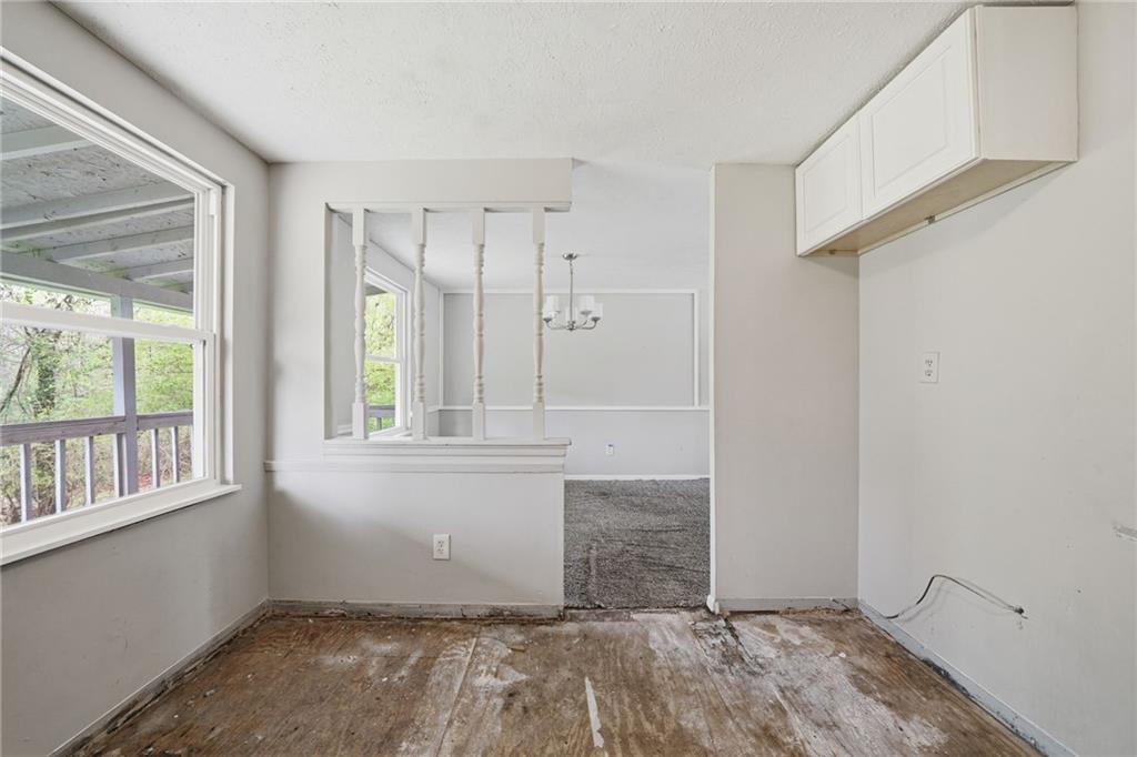 6865 Kimberly Mill Road Atlanta, GA 30349 - Photo 2 of 25 a view of an empty room with a window