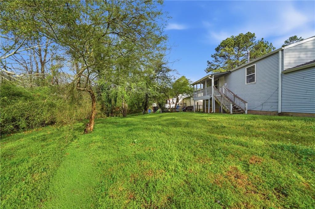 6865 Kimberly Mill Road Atlanta, GA 30349 - Photo 22 of 25 a house view with a garden space