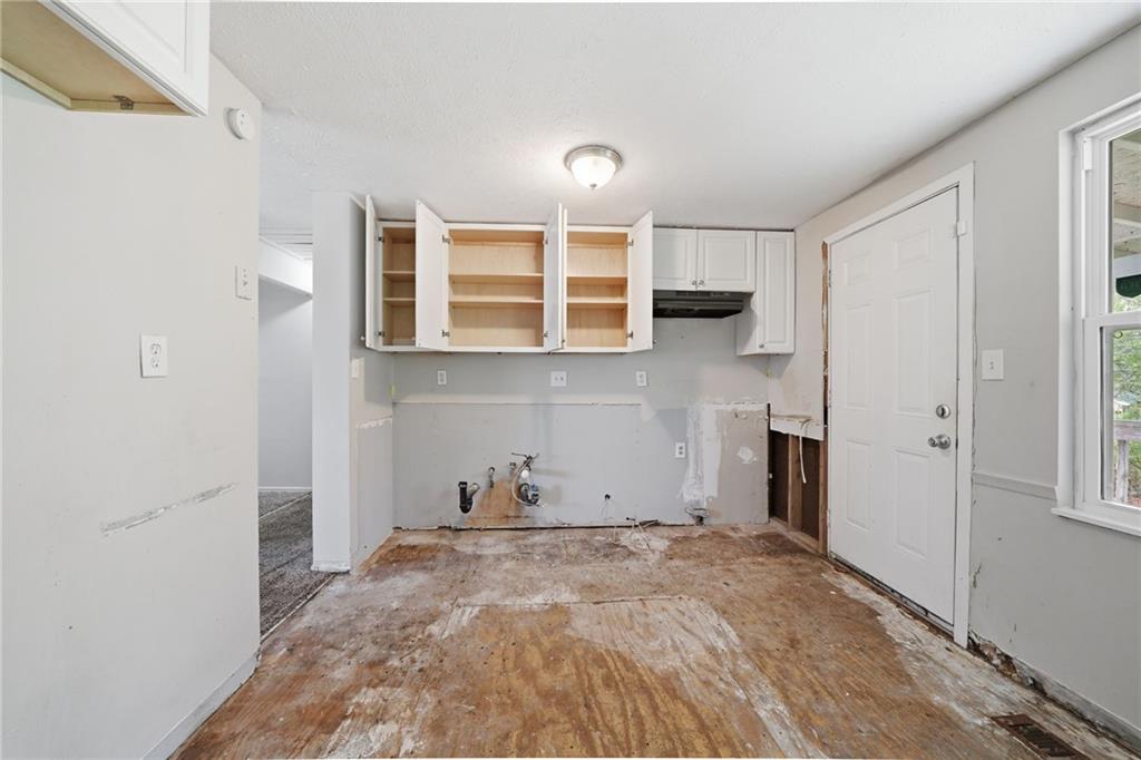 6865 Kimberly Mill Road Atlanta, GA 30349 - Photo 6 of 25 a view of a kitchen with a sink