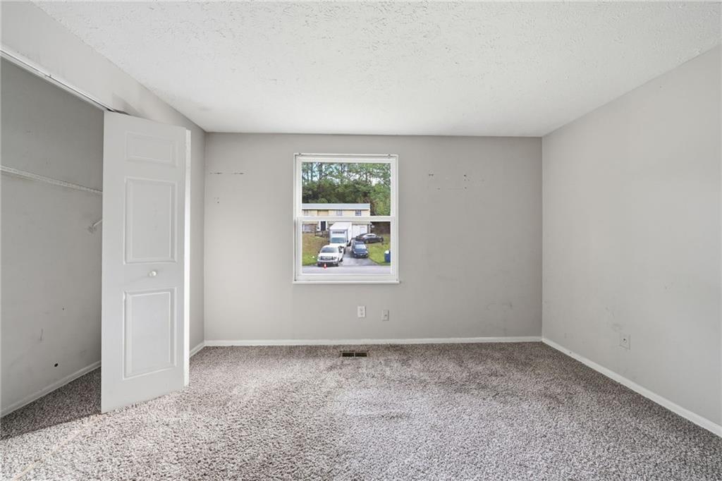 6865 Kimberly Mill Road Atlanta, GA 30349 - Photo 8 of 25 an empty room with a window