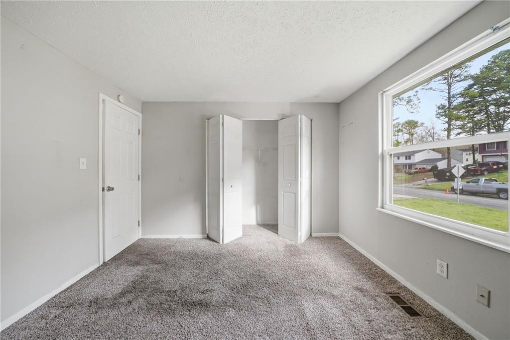 6865 Kimberly Mill Road Atlanta, GA 30349 - Photo 9 of 25 a view of livingroom with window