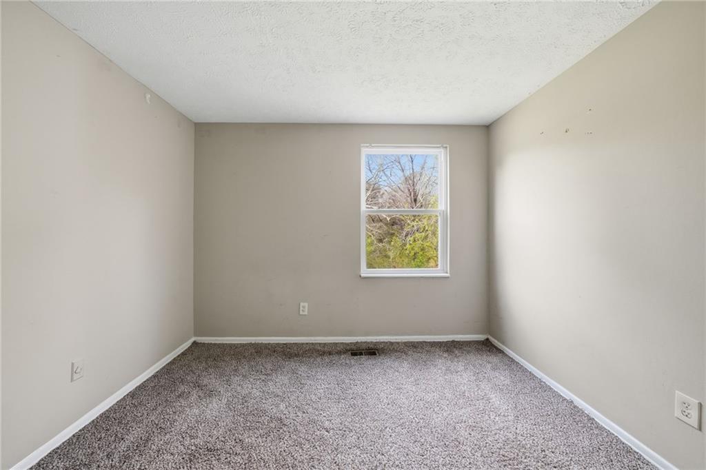 6865 Kimberly Mill Road Atlanta, GA 30349 - Photo 10 of 25 an empty room with a window