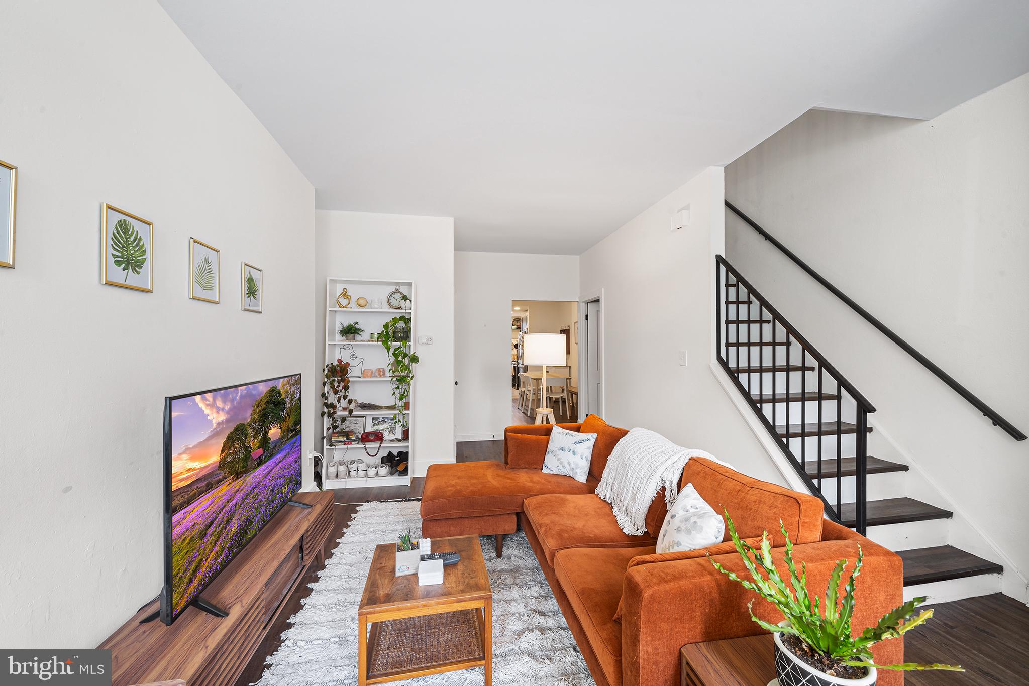 107 Master Street Philadelphia, PA 19122 - Photo 6 of 24 a living room with furniture and a flat screen tv