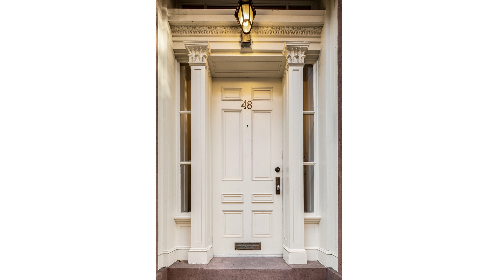 48 Jane Street Manhattan, NY 10014 - Photo 1 of 17 a view of a hallway with a white cabinets