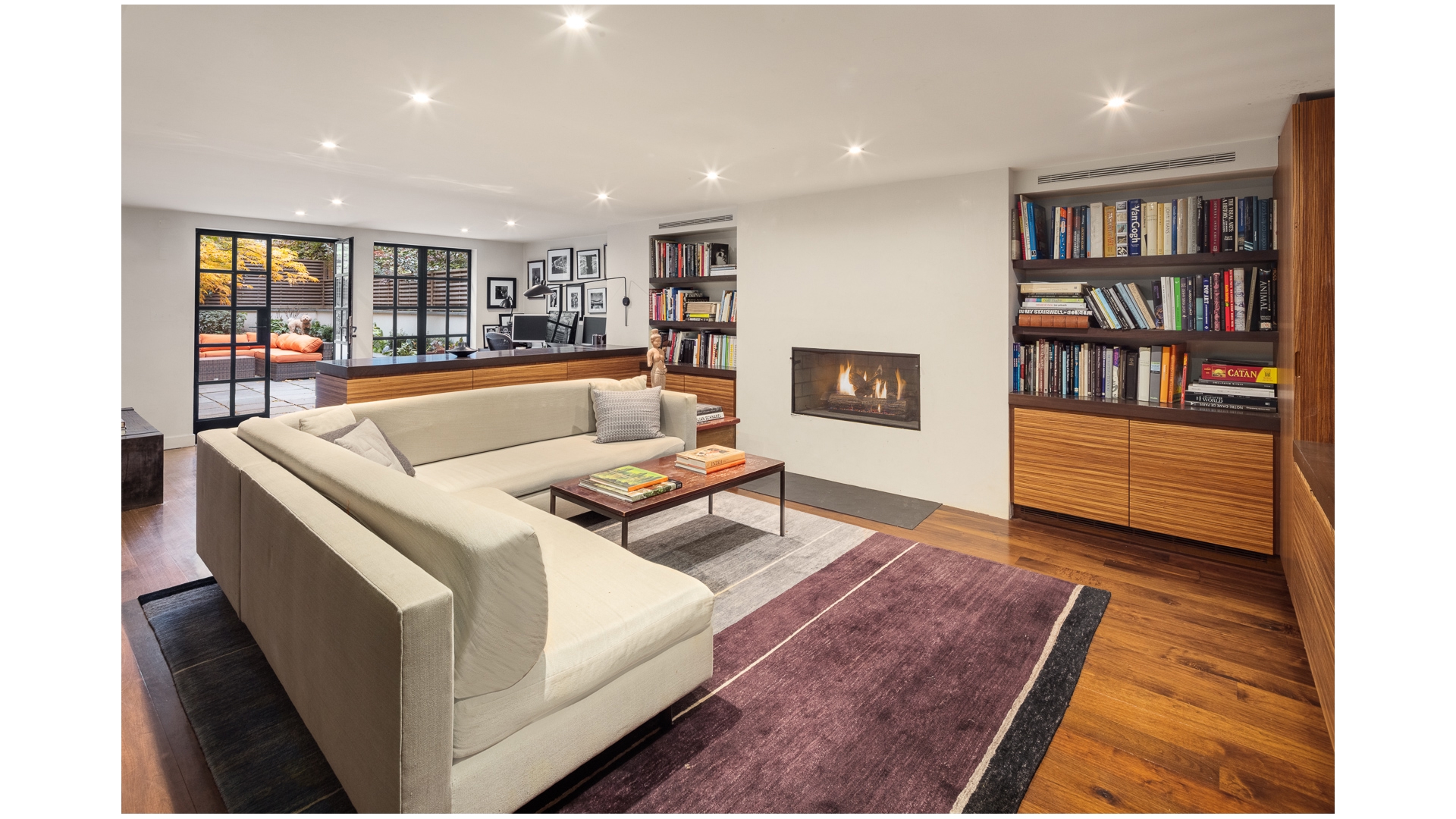 48 Jane Street Manhattan, NY 10014 - Photo 10 of 17 a living room with furniture and a book shelf