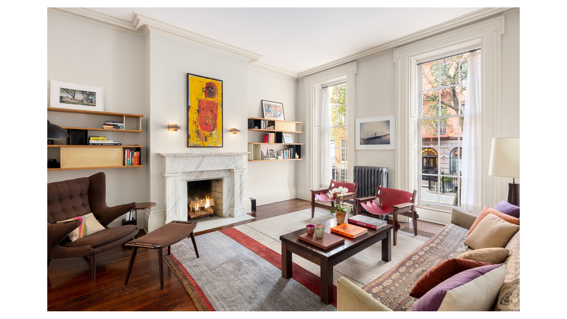 48 Jane Street Manhattan, NY 10014 - Photo 4 of 17 a living room with furniture a fireplace and next to a window