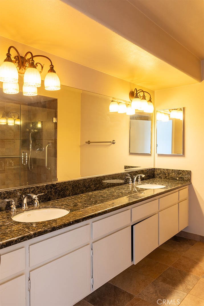 1837 Kelleher Place Placentia, CA 92870 - Photo 17 of 24 a bathroom with a granite countertop sink and a mirror