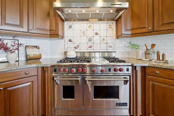a view of a livingroom with wooden floor and a window