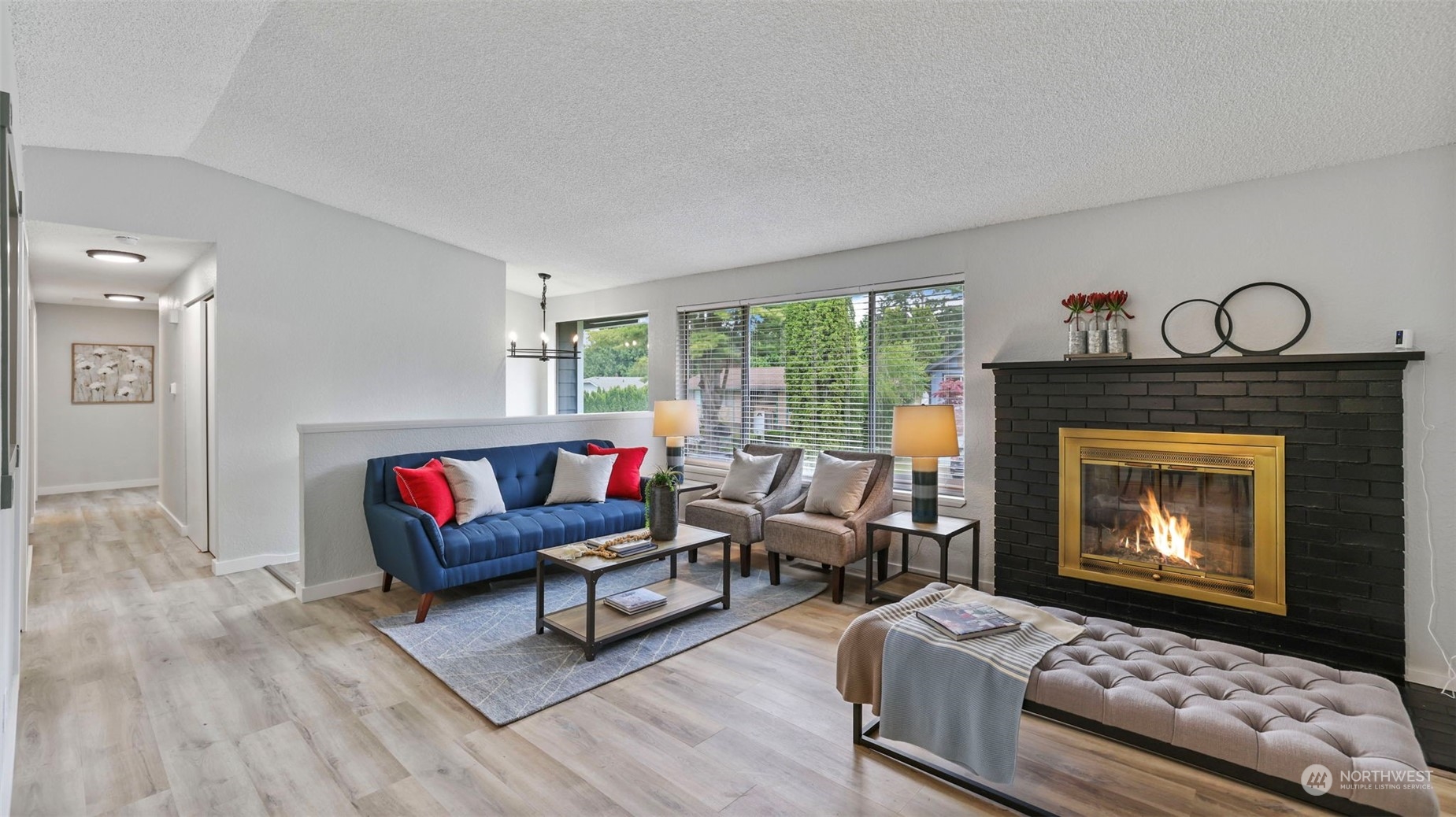 2424 170th Street Southeast Bothell, WA 98012 - Photo 11 of 40 a living room with furniture a rug and a fireplace