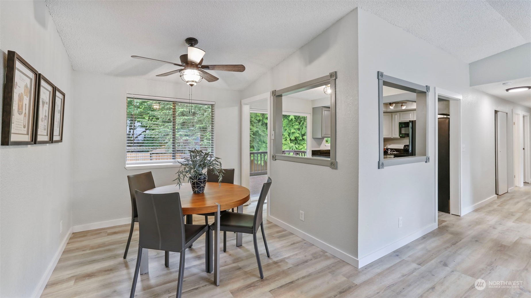 2424 170th Street Southeast Bothell, WA 98012 - Photo 12 of 40 a dining room with furniture window wooden floor