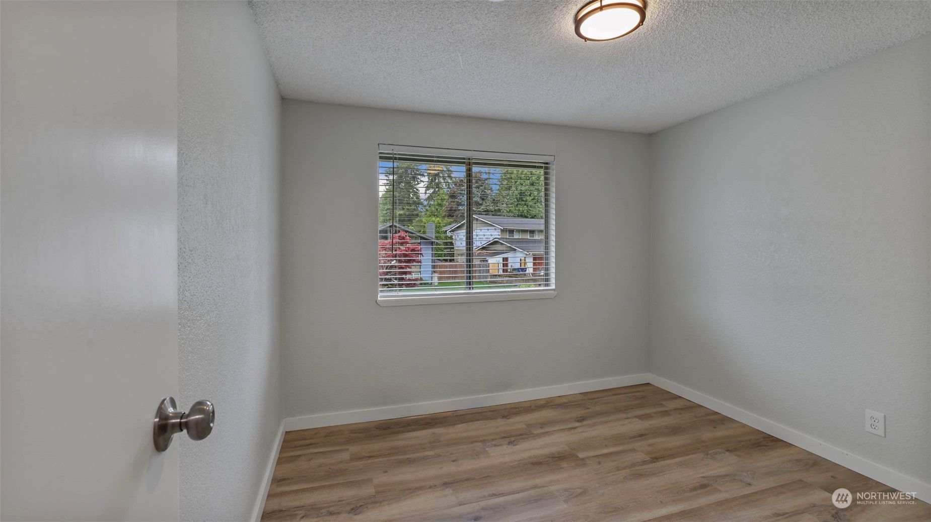 2424 170th Street Southeast Bothell, WA 98012 - Photo 20 of 40 an empty room with a window