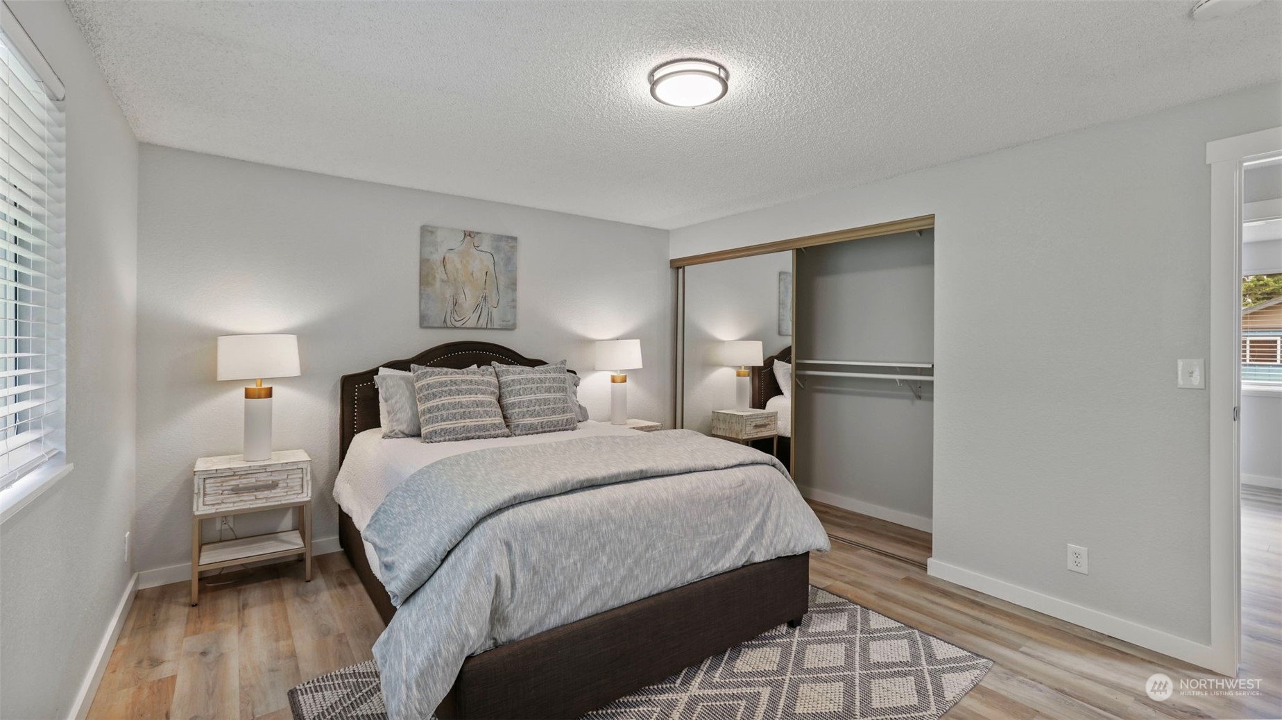 2424 170th Street Southeast Bothell, WA 98012 - Photo 25 of 40 a bedroom with a bed and wooden floor