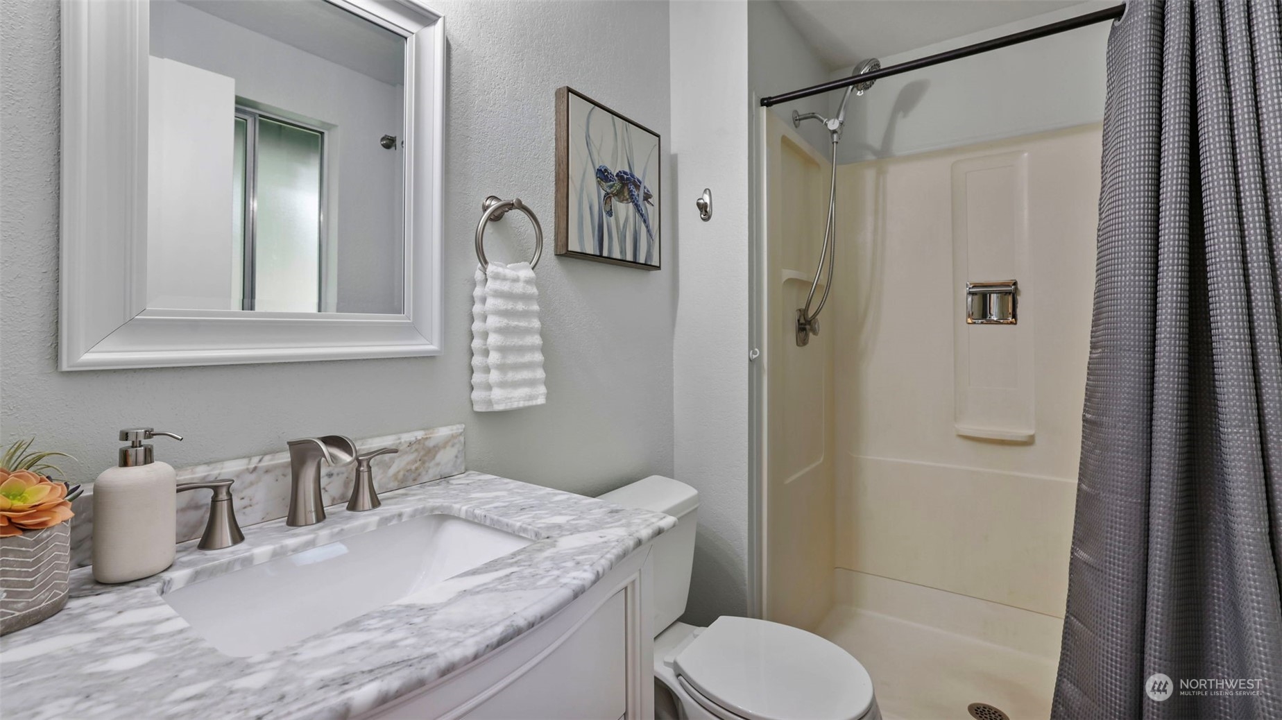 2424 170th Street Southeast Bothell, WA 98012 - Photo 26 of 40 a bathroom with a granite countertop sink toilet and shower