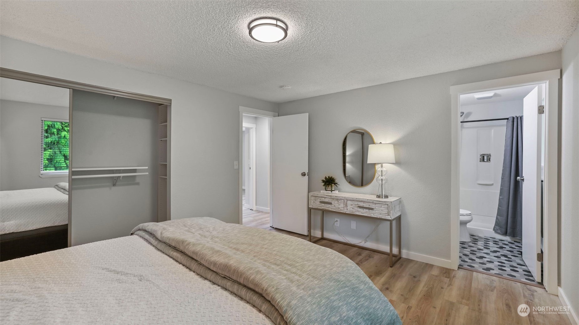 2424 170th Street Southeast Bothell, WA 98012 - Photo 27 of 40 a bedroom with a bed and a view of living room
