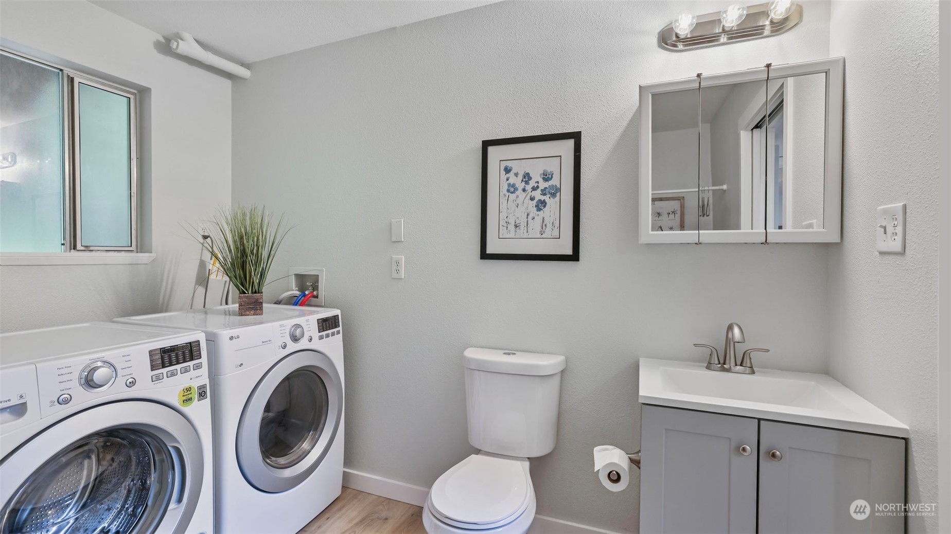 2424 170th Street Southeast Bothell, WA 98012 - Photo 29 of 40 a view of bathroom with a washer and dryer