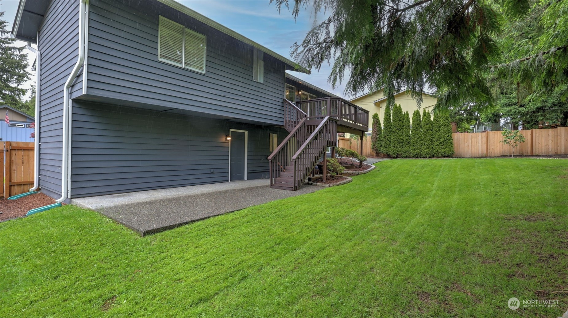 2424 170th Street Southeast Bothell, WA 98012 - Photo 34 of 40 a view of a house with a yard and a large tree