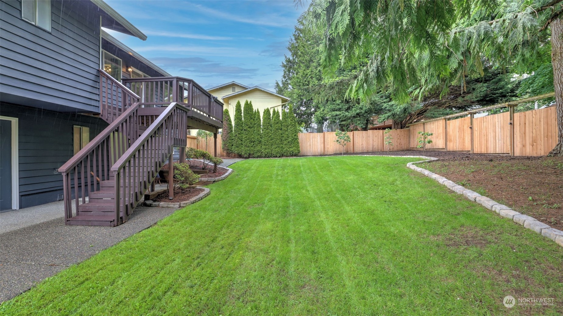 2424 170th Street Southeast Bothell, WA 98012 - Photo 35 of 40 a view of an house with backyard and deck