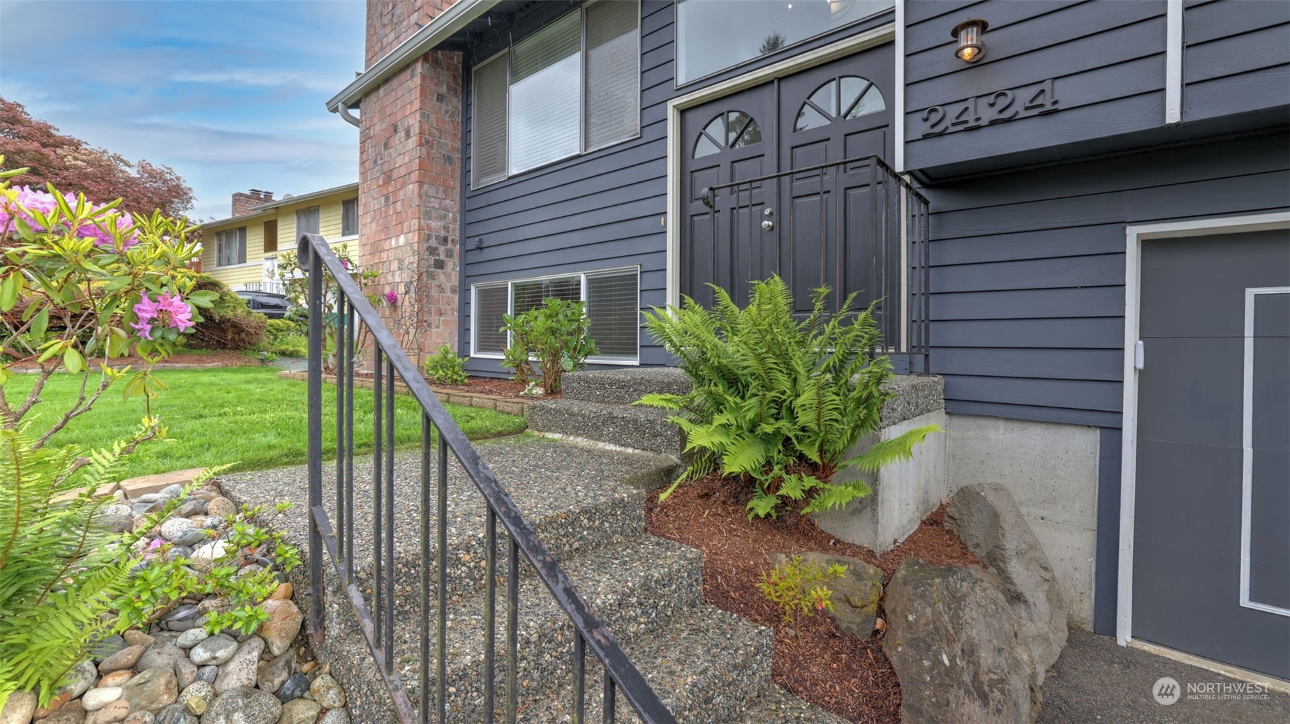 2424 170th Street Southeast Bothell, WA 98012 - Photo 7 of 40 a view of a house with a yard