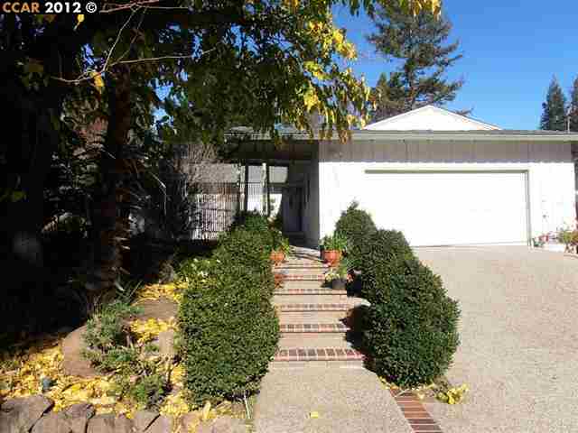 237 Ramona Road Danville, CA 94526 - Photo 1 of 1 a front view of a house with a yard and fountain in middle