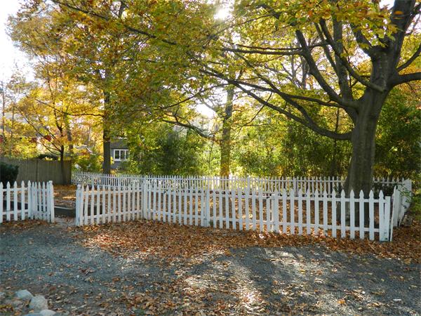 22-24 Puritan Road Marblehead, MA 01945 - Photo 14 of 15 a view of a yard with wooden fence