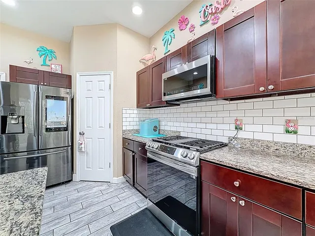 a bedroom with bed and flat screen tv